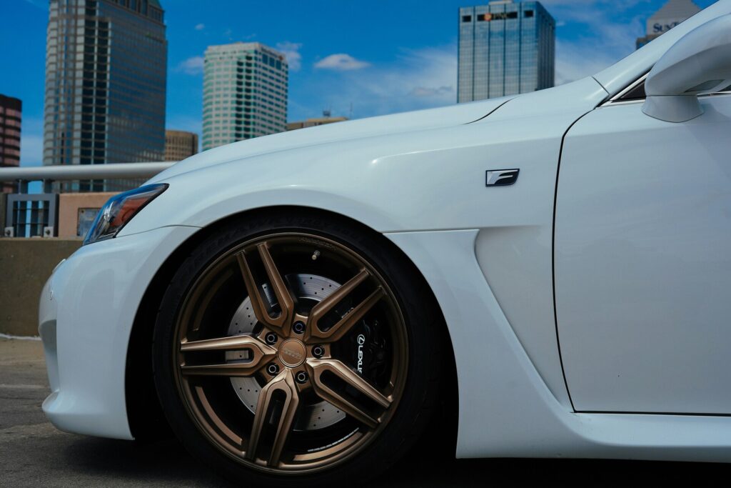 Cloudy day of Lexus old school tuning car with gold wheels