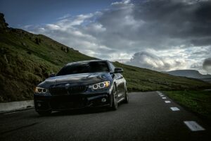 Beautiful front of BMW Sport Car on Romanian mountain road